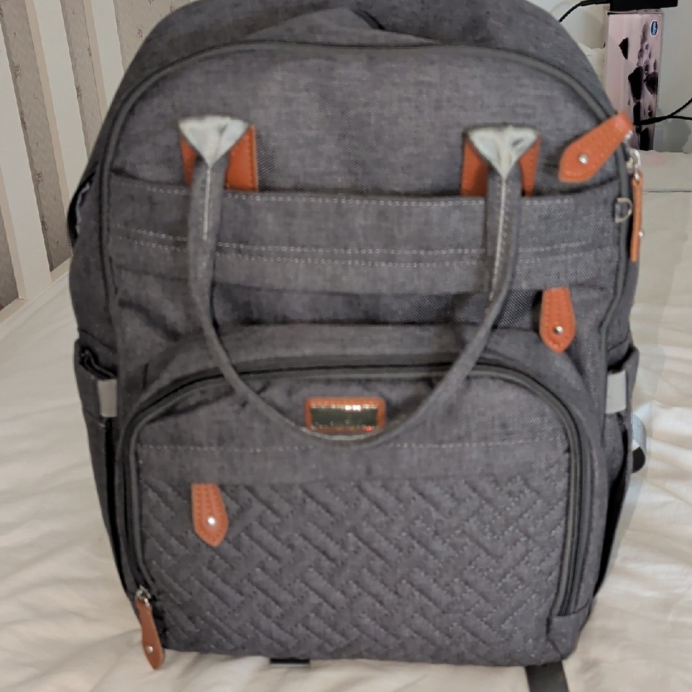 Gray Quilted Backpack with Brown Trim